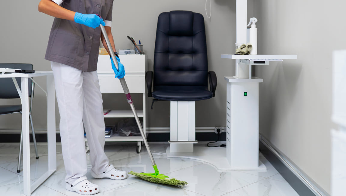 woman-cleaning-ophthalmologist-s-office 1